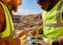 Miners Inspecting Minerals